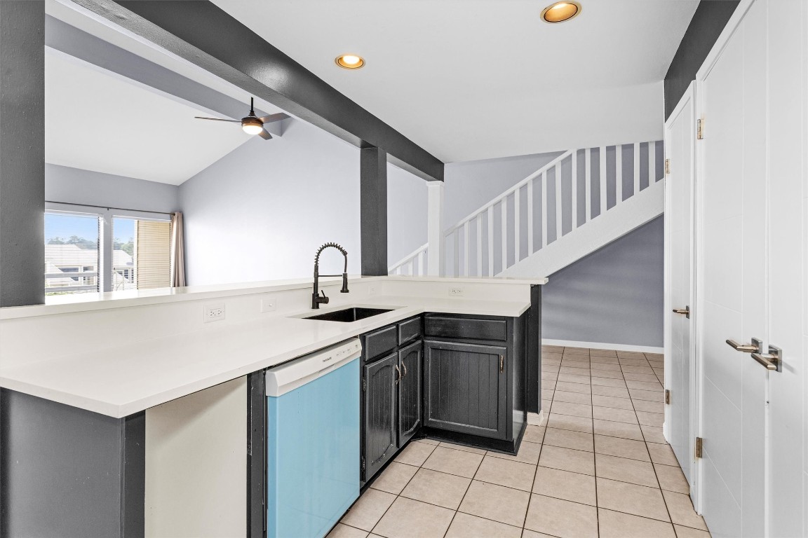 50 April Point Drive South Conroe, TX 77356 - Photo 13 of 30 a kitchen with a sink cabinets and window