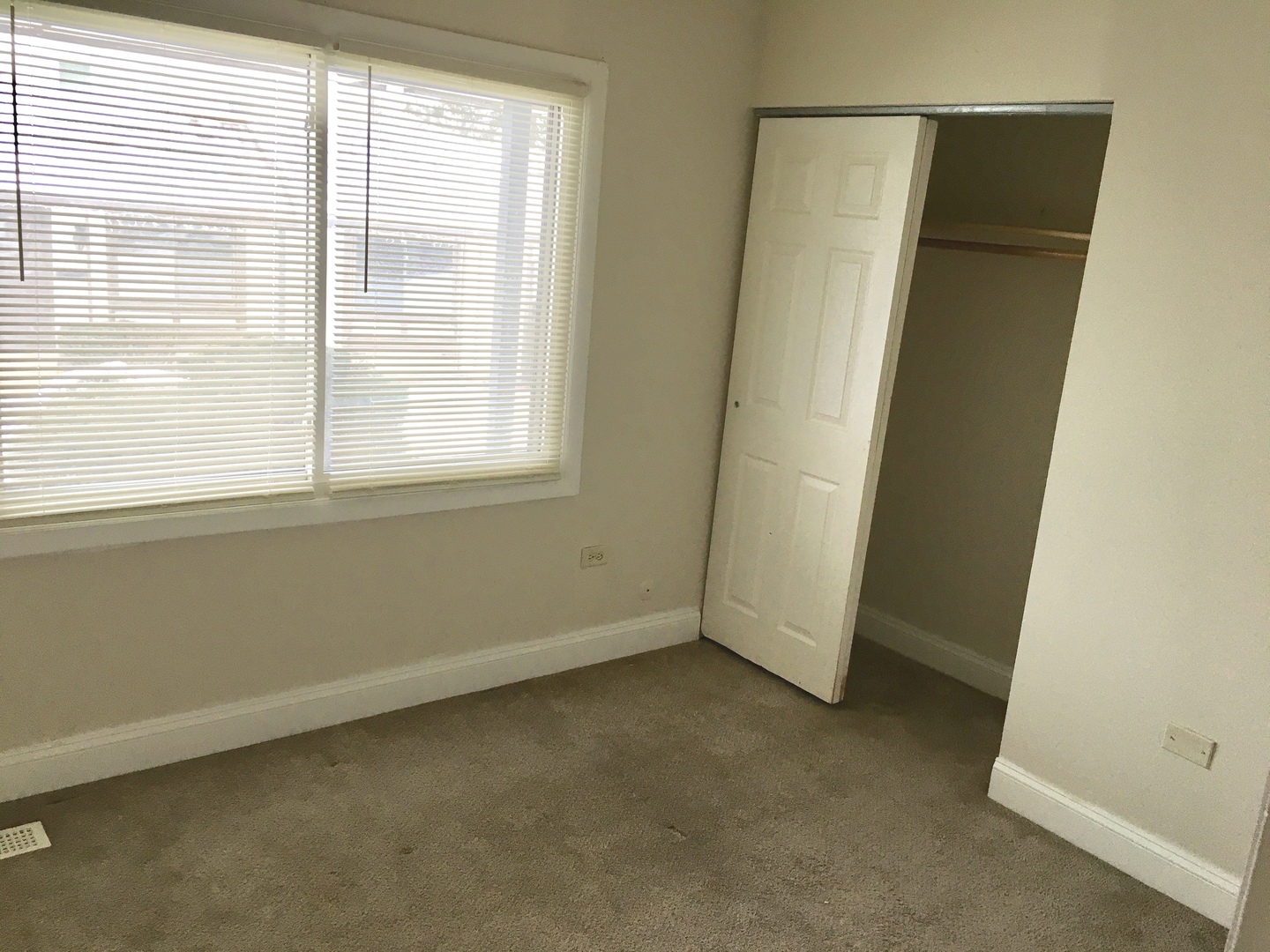 Undisclosed Address Hanover Park, IL 60133 - Photo 7 of 10 an empty room with a window