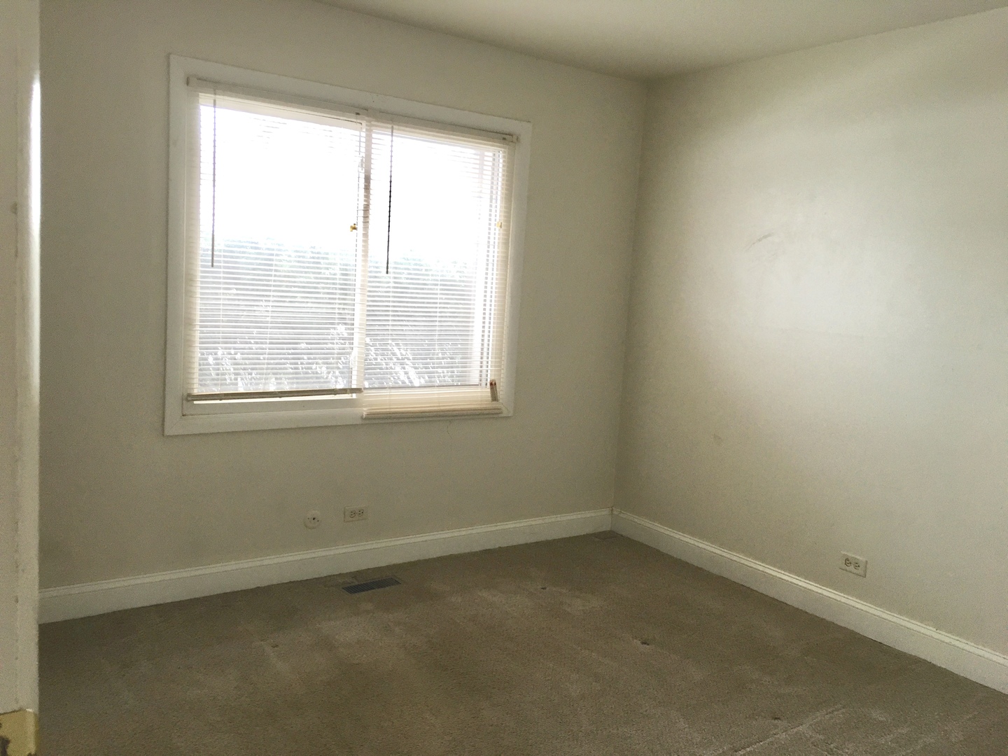 Undisclosed Address Hanover Park, IL 60133 - Photo 9 of 10 an empty room with a window