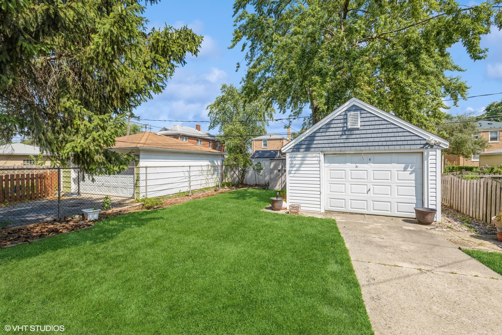 4123 Maple Avenue Brookfield, IL 60513 - Photo 18 of 18 a front view of a house with a yard and garage