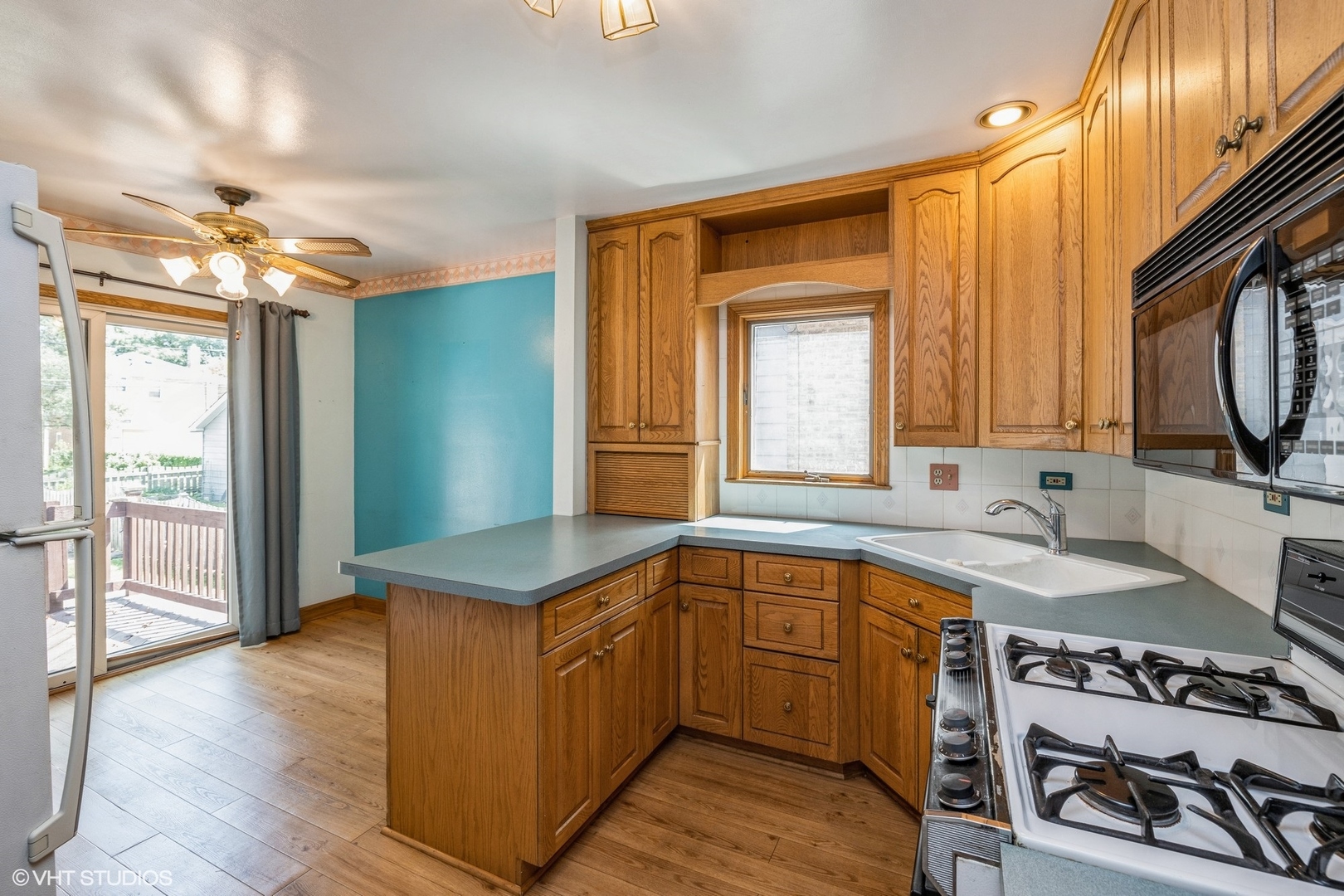 4123 Maple Avenue Brookfield, IL 60513 - Photo 7 of 18 a kitchen with a sink stove and cabinets