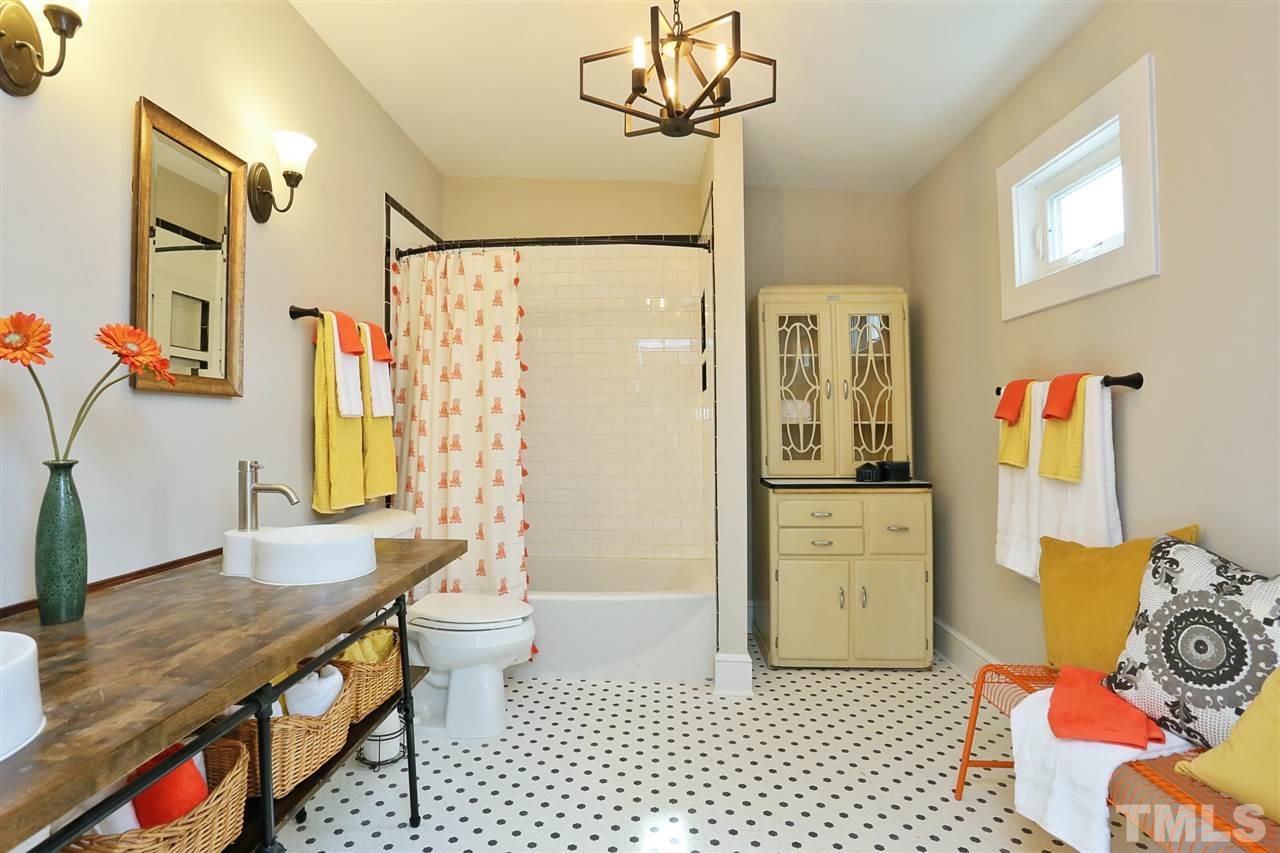 519 Washington Street Raleigh, NC 27605 - Photo 22 of 30 a bathroom with a sink a toilet and shower