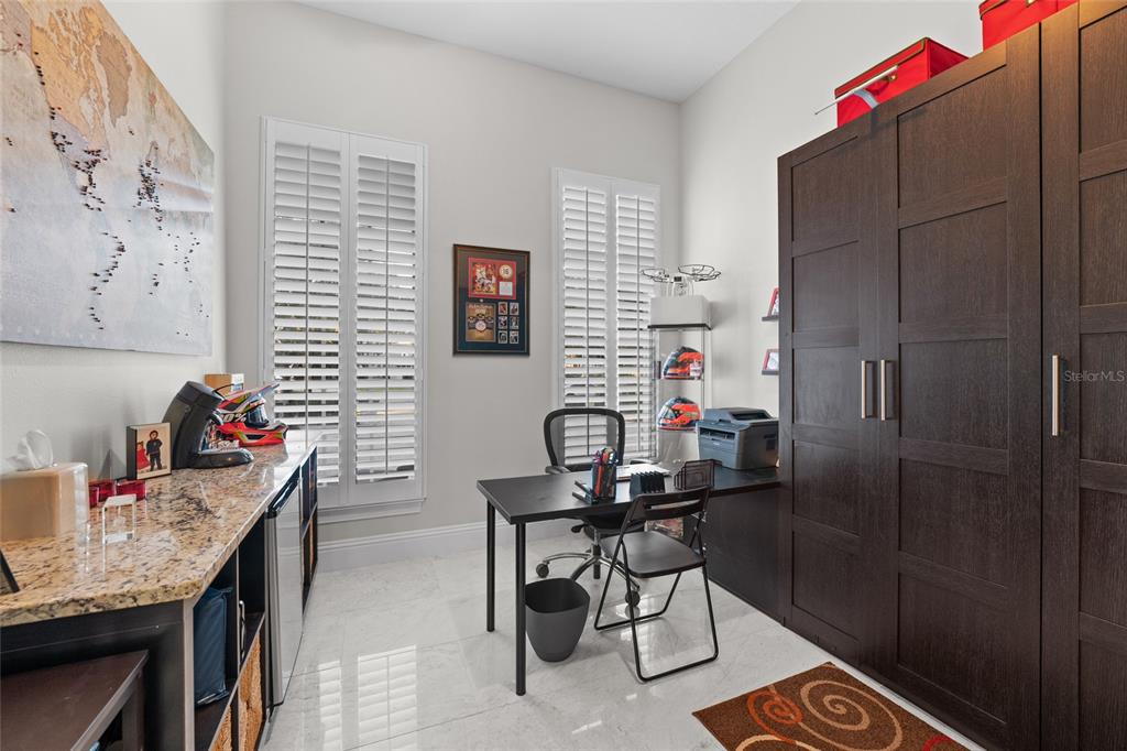 6001 Caymus Loop Windermere, FL 34786 - Photo 18 of 44 a room that has a table and a chair in it