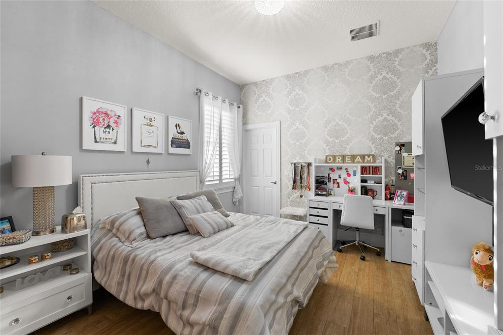 6001 Caymus Loop Windermere, FL 34786 - Photo 22 of 44 a bedroom with a bed and a flat screen tv