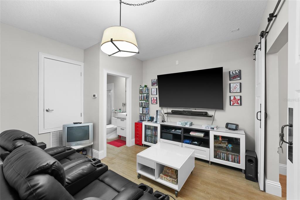 6001 Caymus Loop Windermere, FL 34786 - Photo 28 of 44 a living room with furniture and a flat screen tv