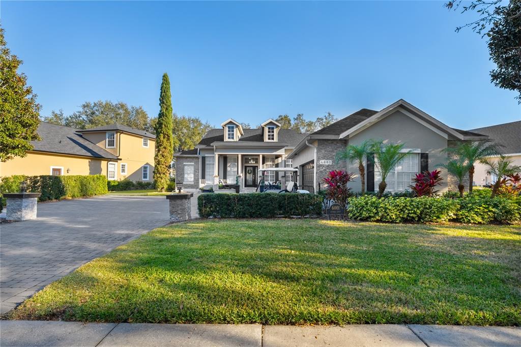 6001 Caymus Loop Windermere, FL 34786 - Photo 3 of 44 a front view of a house with garden