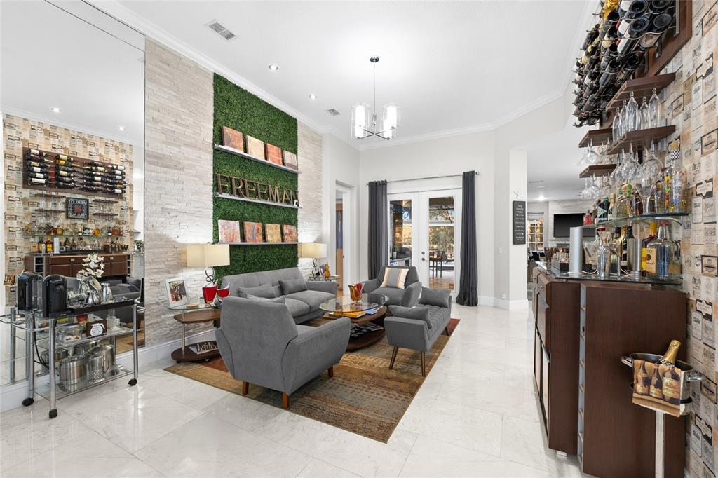 6001 Caymus Loop Windermere, FL 34786 - Photo 6 of 44 a living room with furniture and a floor to ceiling window