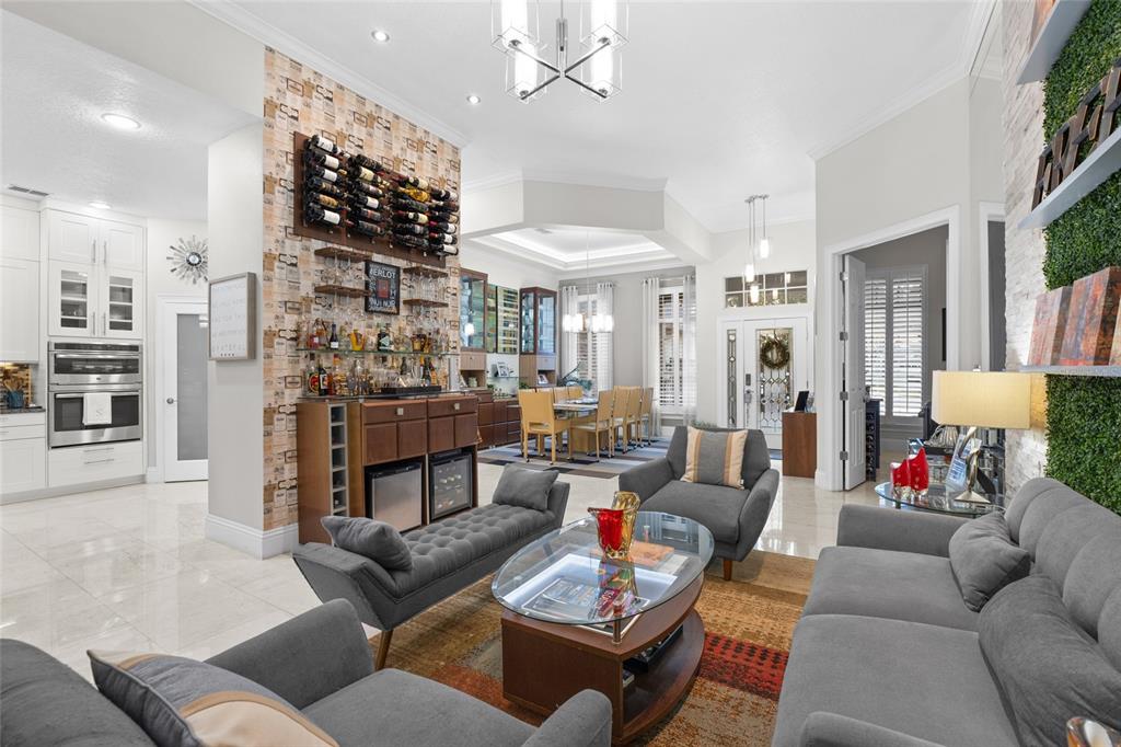 6001 Caymus Loop Windermere, FL 34786 - Photo 8 of 44 a living room with furniture and a fireplace