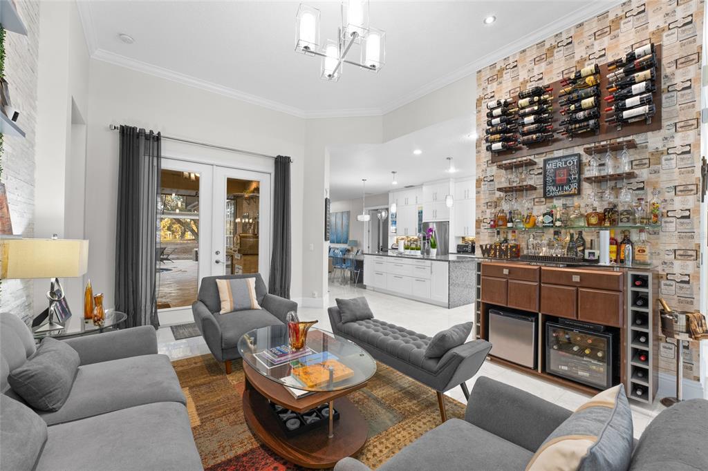 6001 Caymus Loop Windermere, FL 34786 - Photo 9 of 44 a living room with furniture and a fireplace