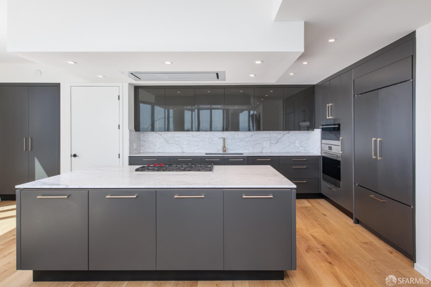 201 Folsom Street, Unit PH41C San Francisco, CA 94105 - Photo 14 of 72 a kitchen with stainless steel appliances granite countertop a sink stove and refrigerator