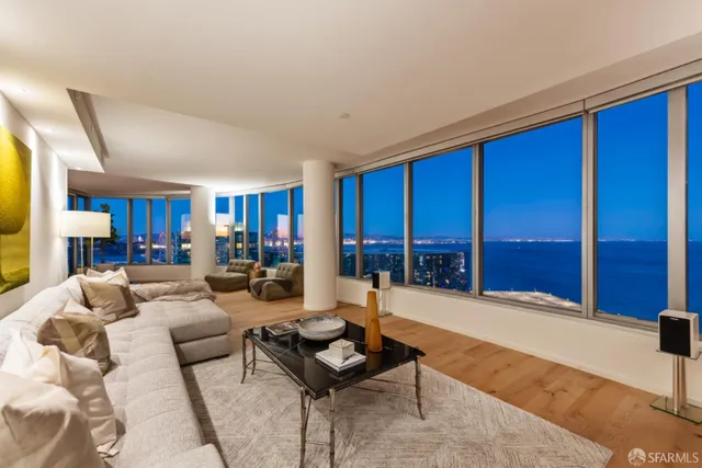 a living room with couches and painted walls