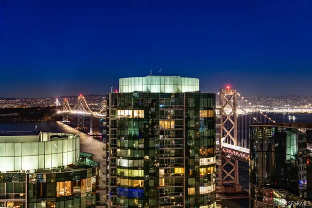 a view of balcony with two chairs and a swing