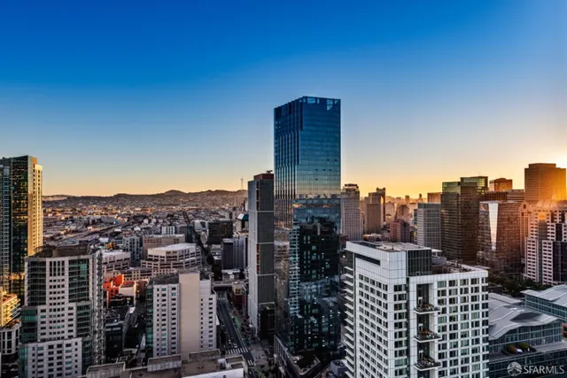 a dining table with chairs and cabinets