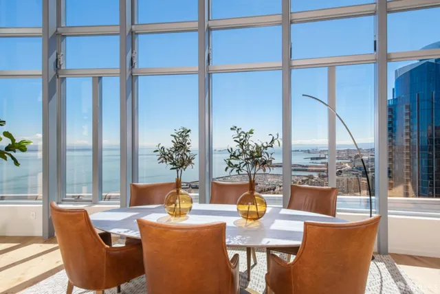 a view of a balcony dining table and chairs
