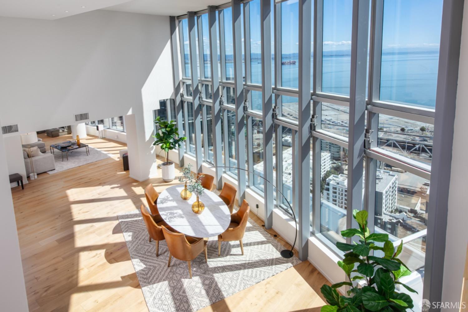 201 Folsom Street, Unit PH41C San Francisco, CA 94105 - Photo 6 of 72 a view of a balcony dining table and chairs