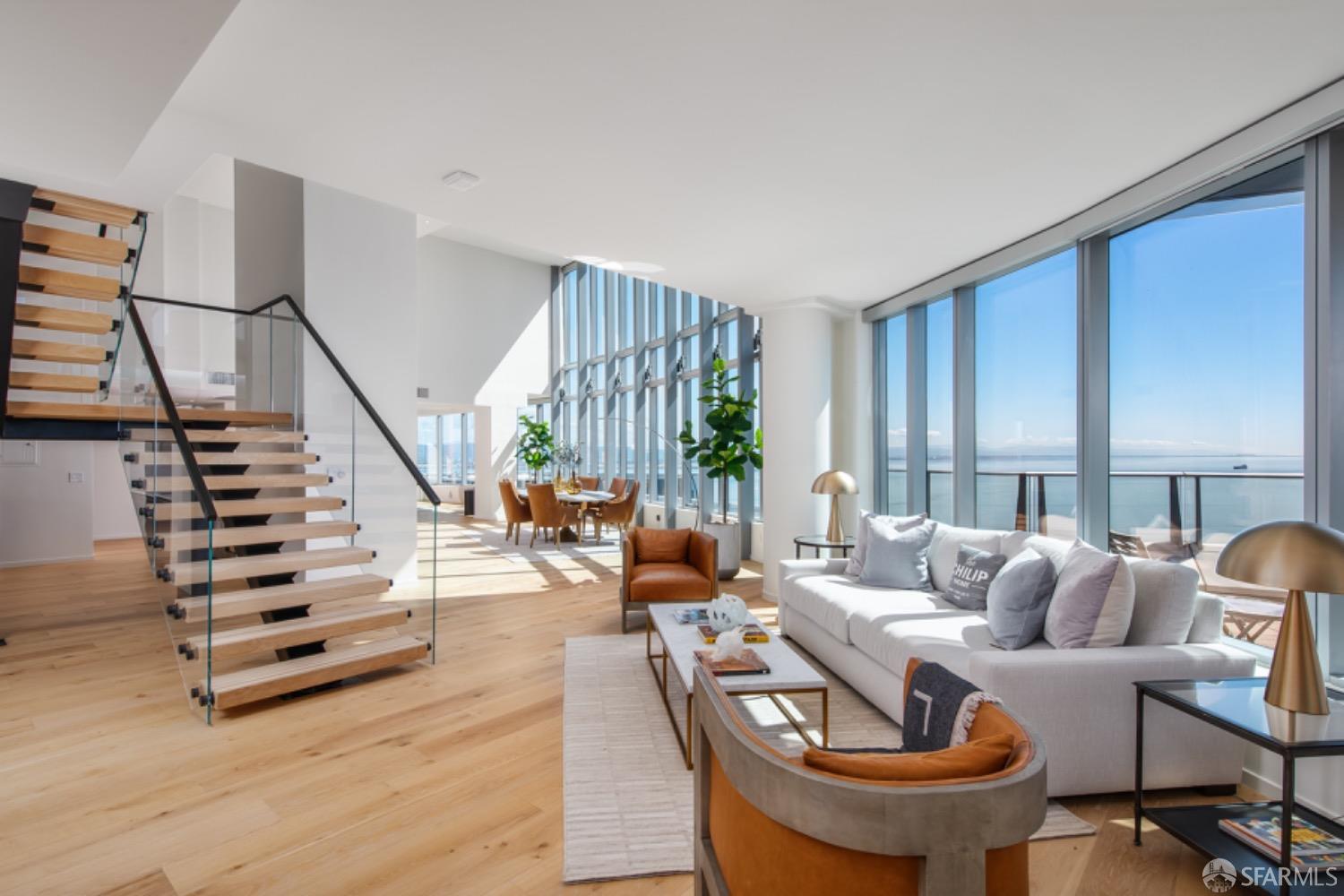 201 Folsom Street, Unit PH41C San Francisco, CA 94105 - Photo 7 of 72 a living room with furniture and a large window