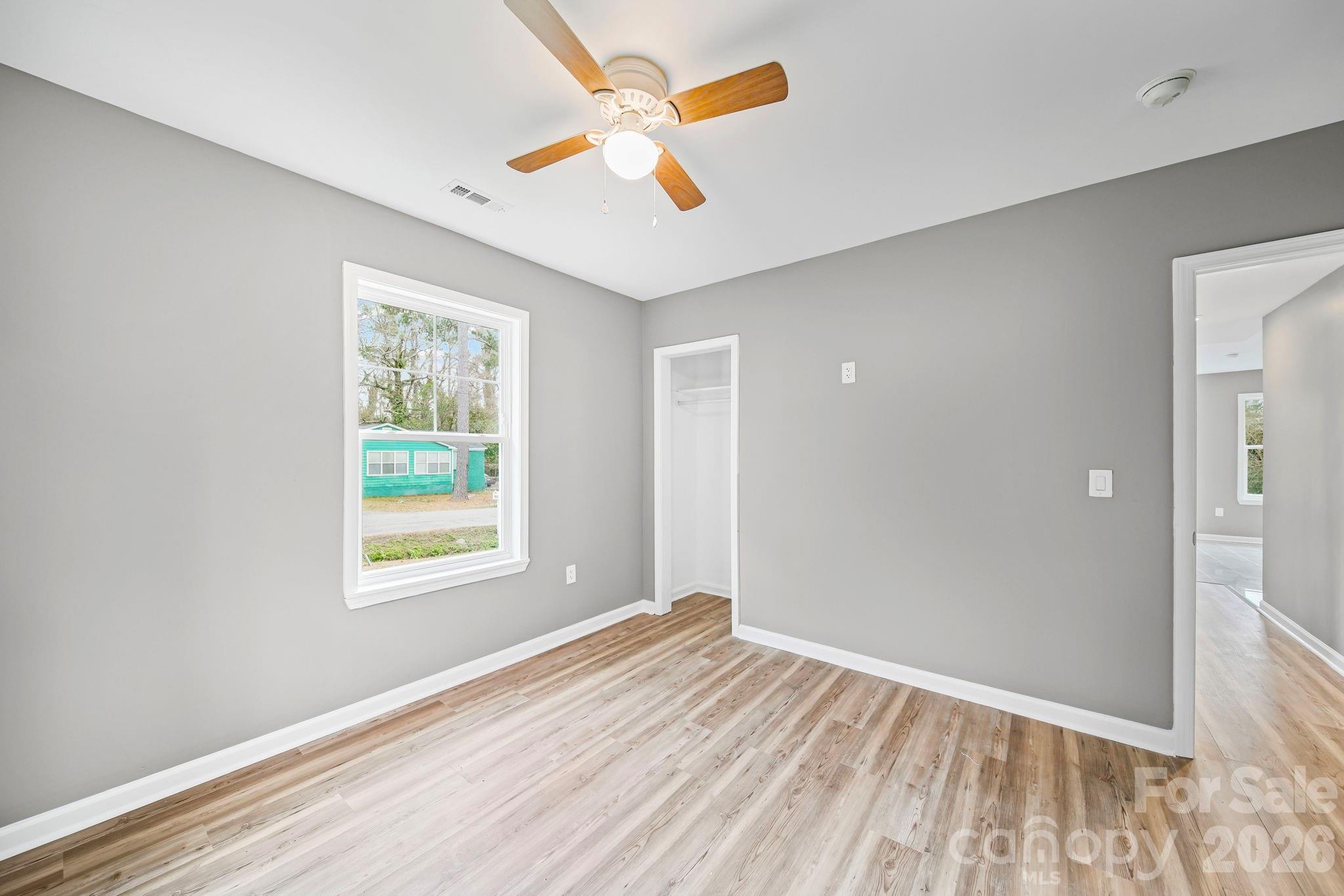 4913 Jones Street, Unit 12 Columbia, SC 29203 - Photo 11 of 17 wooden floor in an empty room with a window