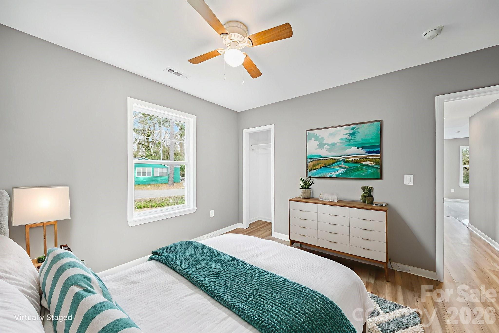 4913 Jones Street, Unit 12 Columbia, SC 29203 - Photo 17 of 17 a bedroom with a bed and a chandelier