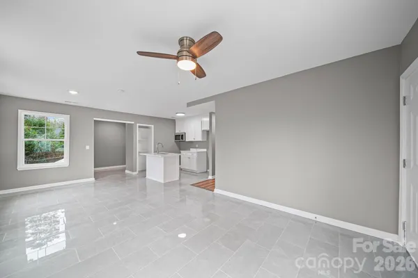 a view of livingroom with hardwood floor and a ceiling fan