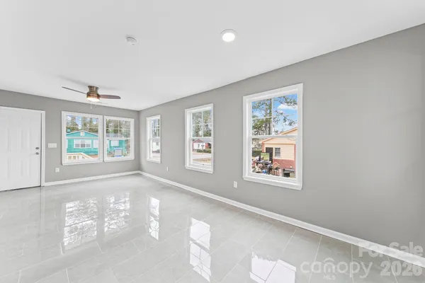 a view of an empty room with a window