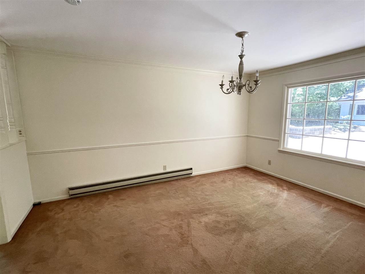 256 Thompson Drive Ripley, TN 38063 - Photo 14 of 17 wooden floor in an empty room with a window