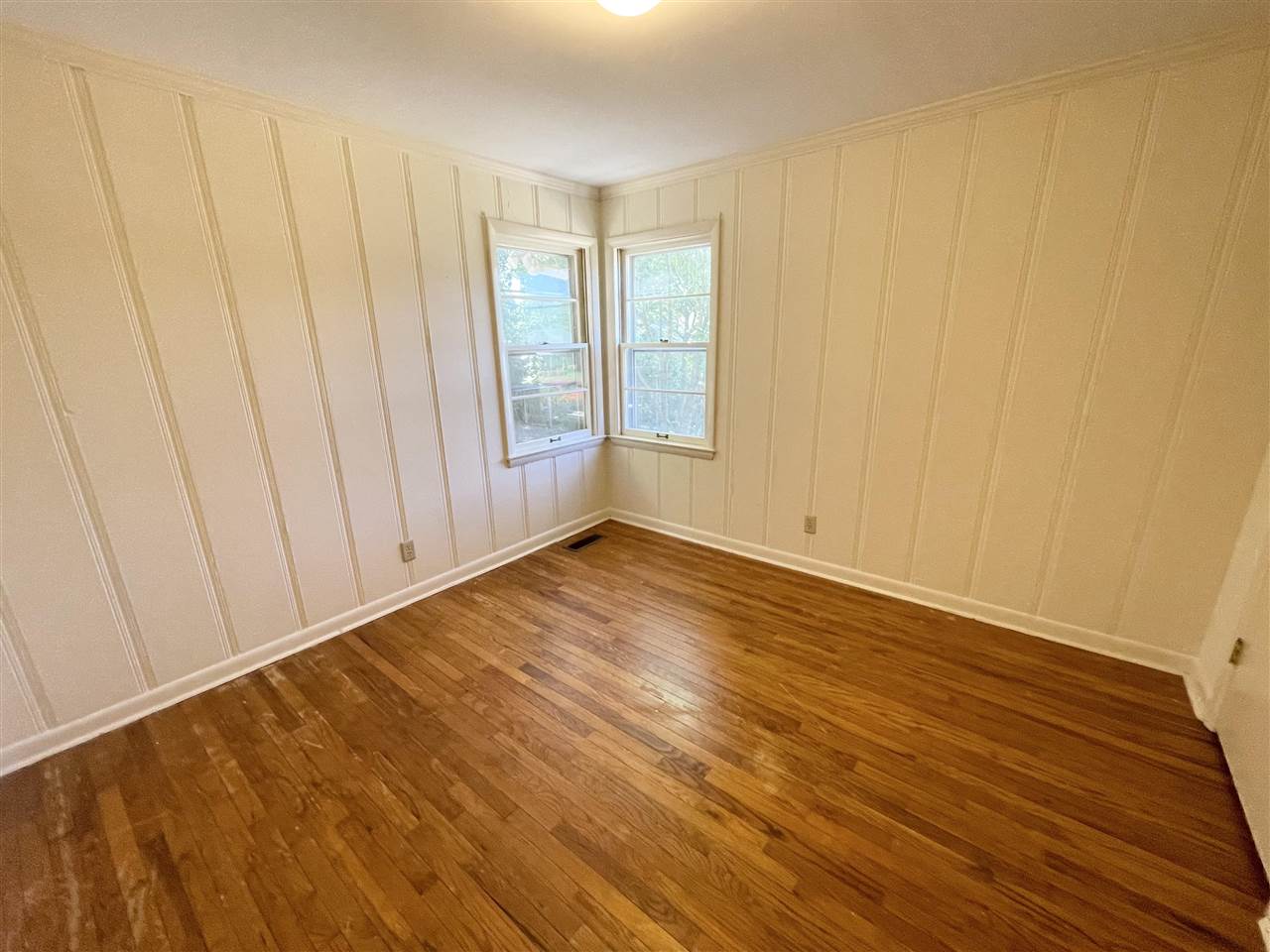 256 Thompson Drive Ripley, TN 38063 - Photo 7 of 17 a view of an empty room with wooden floor