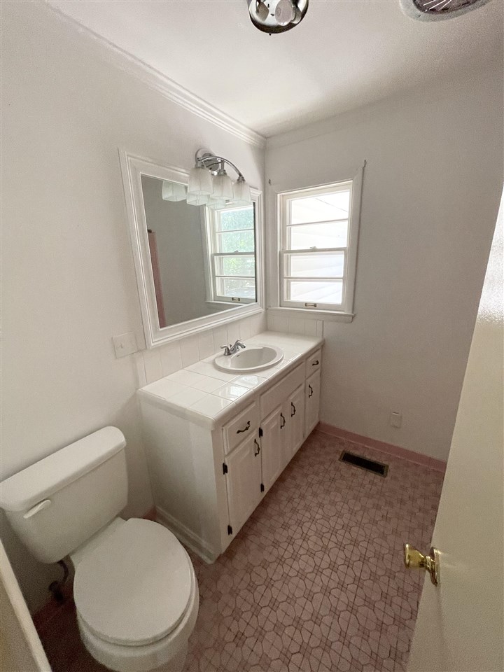 256 Thompson Drive Ripley, TN 38063 - Photo 8 of 17 a bathroom with a sink a toilet and mirror