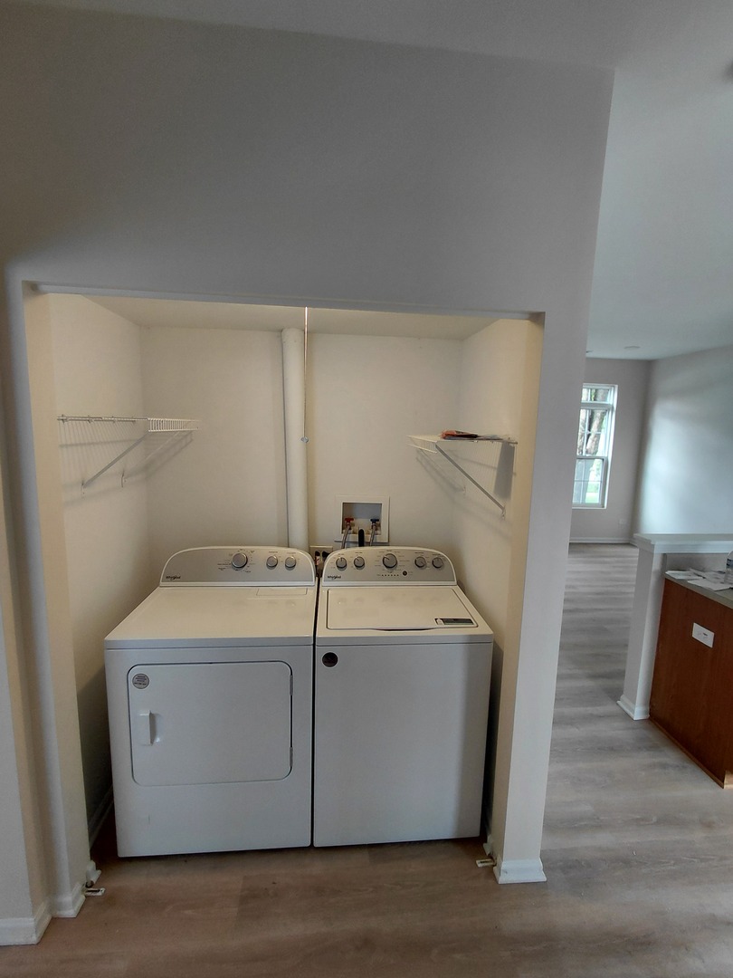 7214 Bradley Drive Plainfield, IL 60586 - Photo 8 of 21 a utility room with dryer and washer