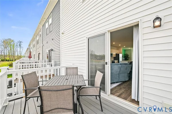 a view of a balcony with furniture