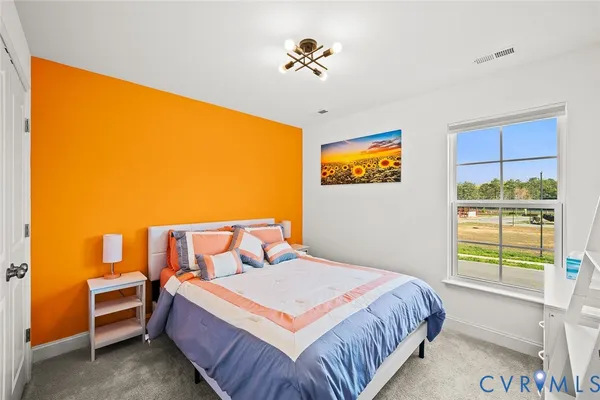 a bed room with a bed and furniture