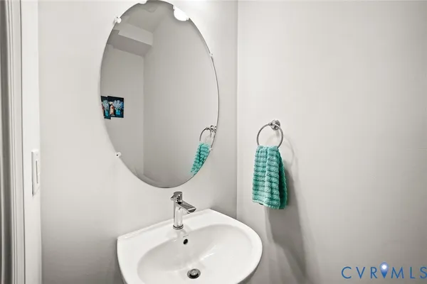 a bathroom with a sink and mirror