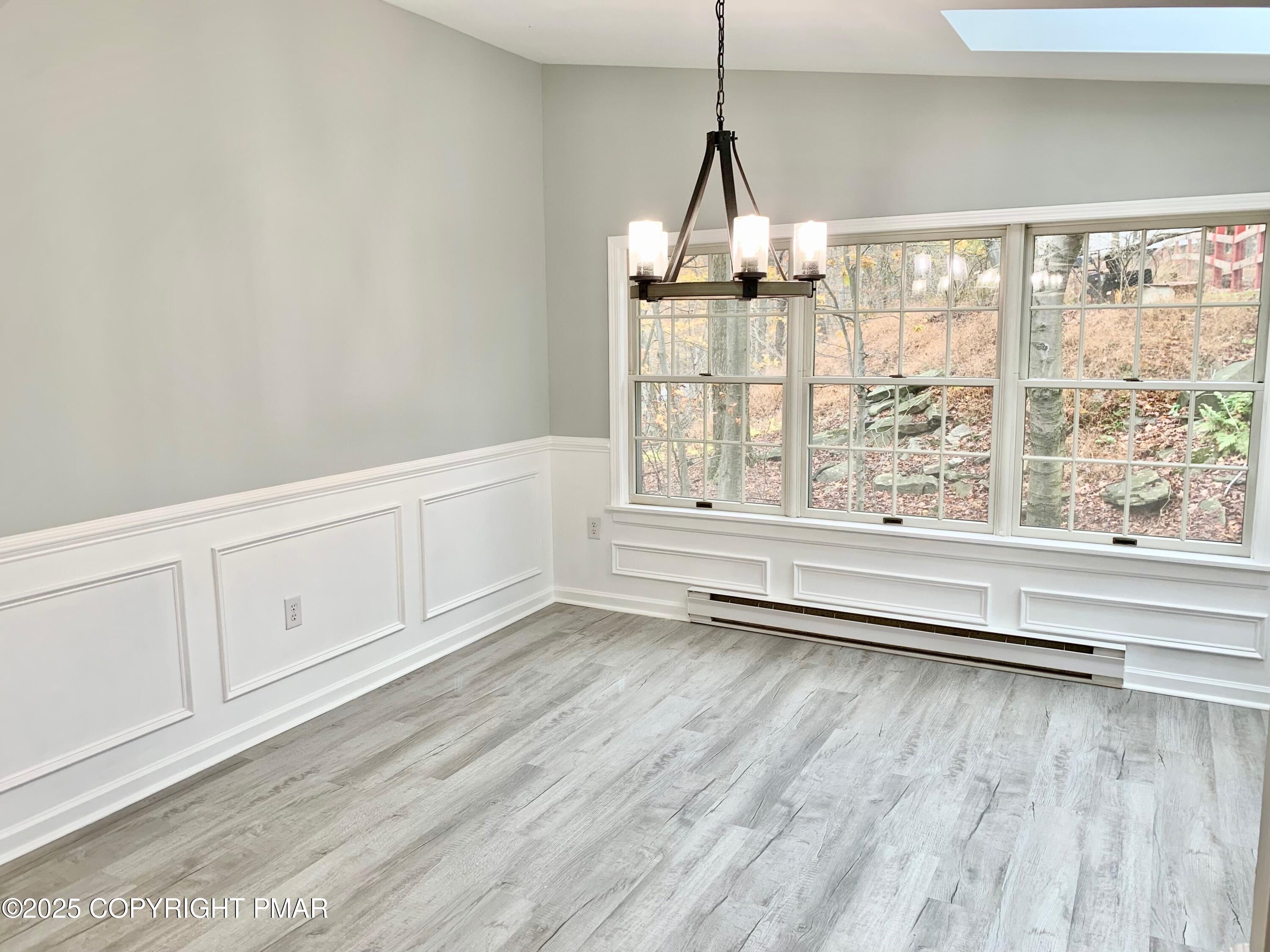 111 Lake In The Clouds Road Canadensis, PA 18325 - Photo 17 of 39 a view of an empty room with wooden floor and a window