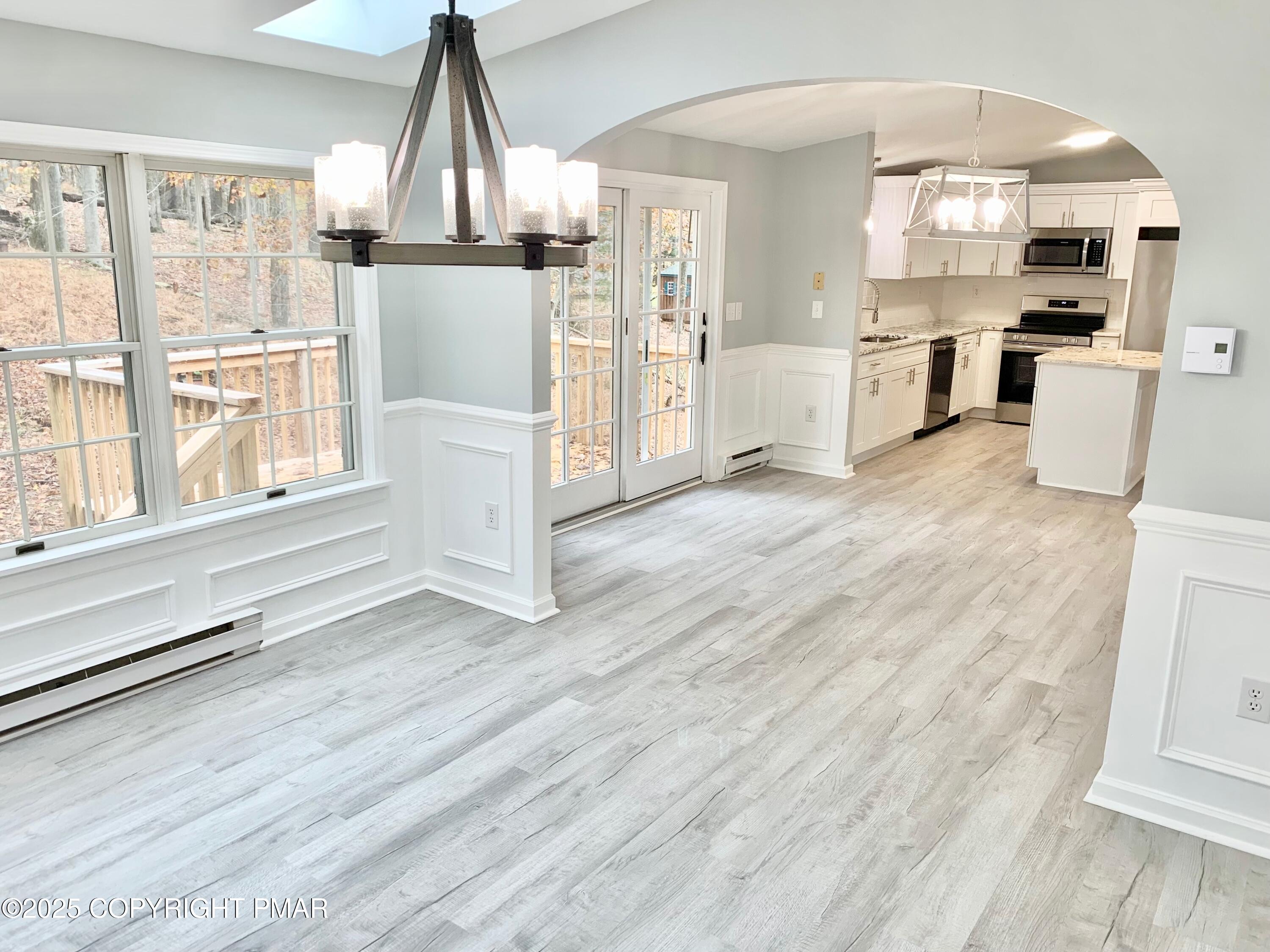 111 Lake In The Clouds Road Canadensis, PA 18325 - Photo 18 of 39 a view of a kitchen with wooden floor and electronic appliances