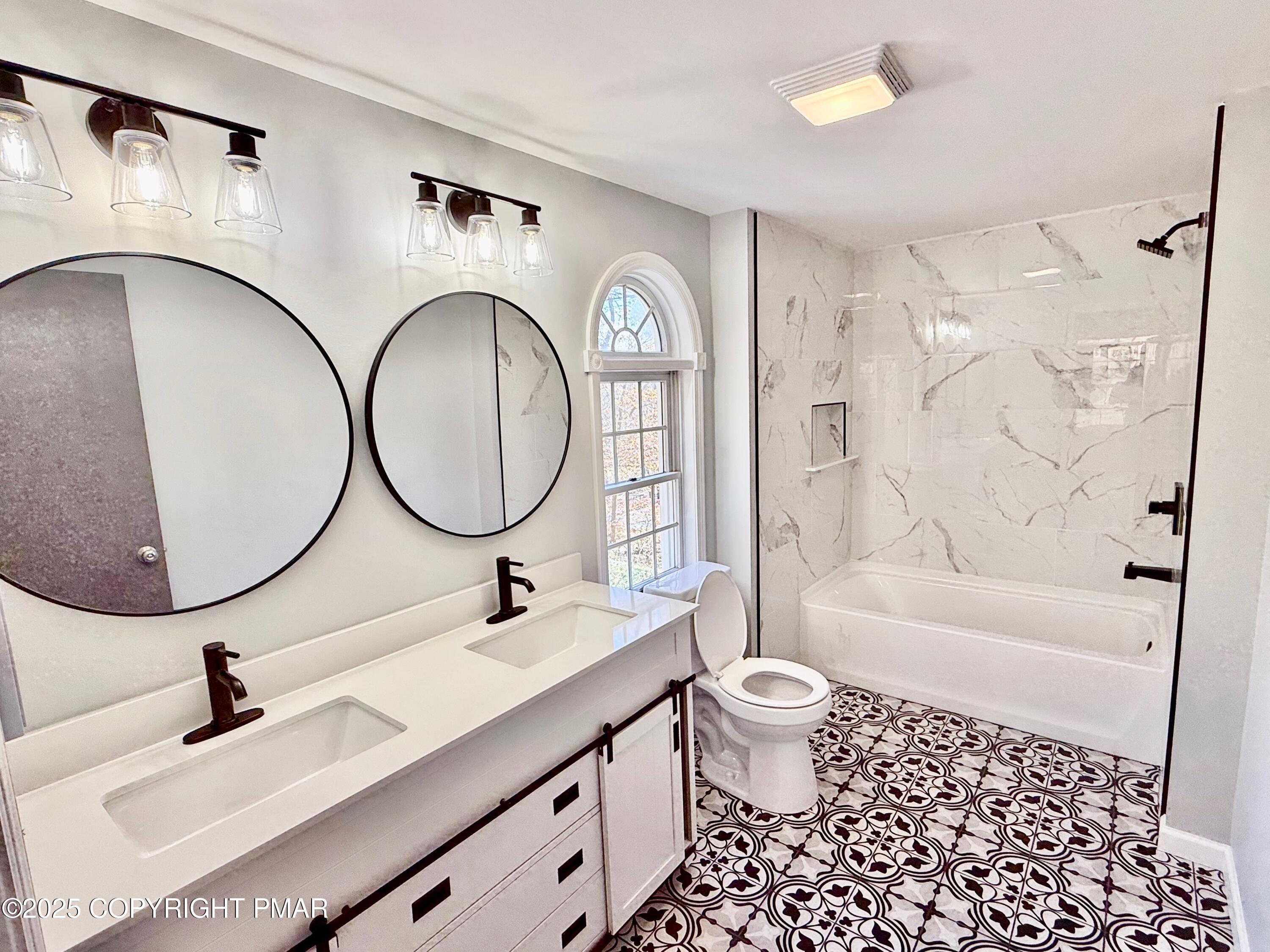 111 Lake In The Clouds Road Canadensis, PA 18325 - Photo 19 of 39 a bathroom with a sink a toilet and a mirror