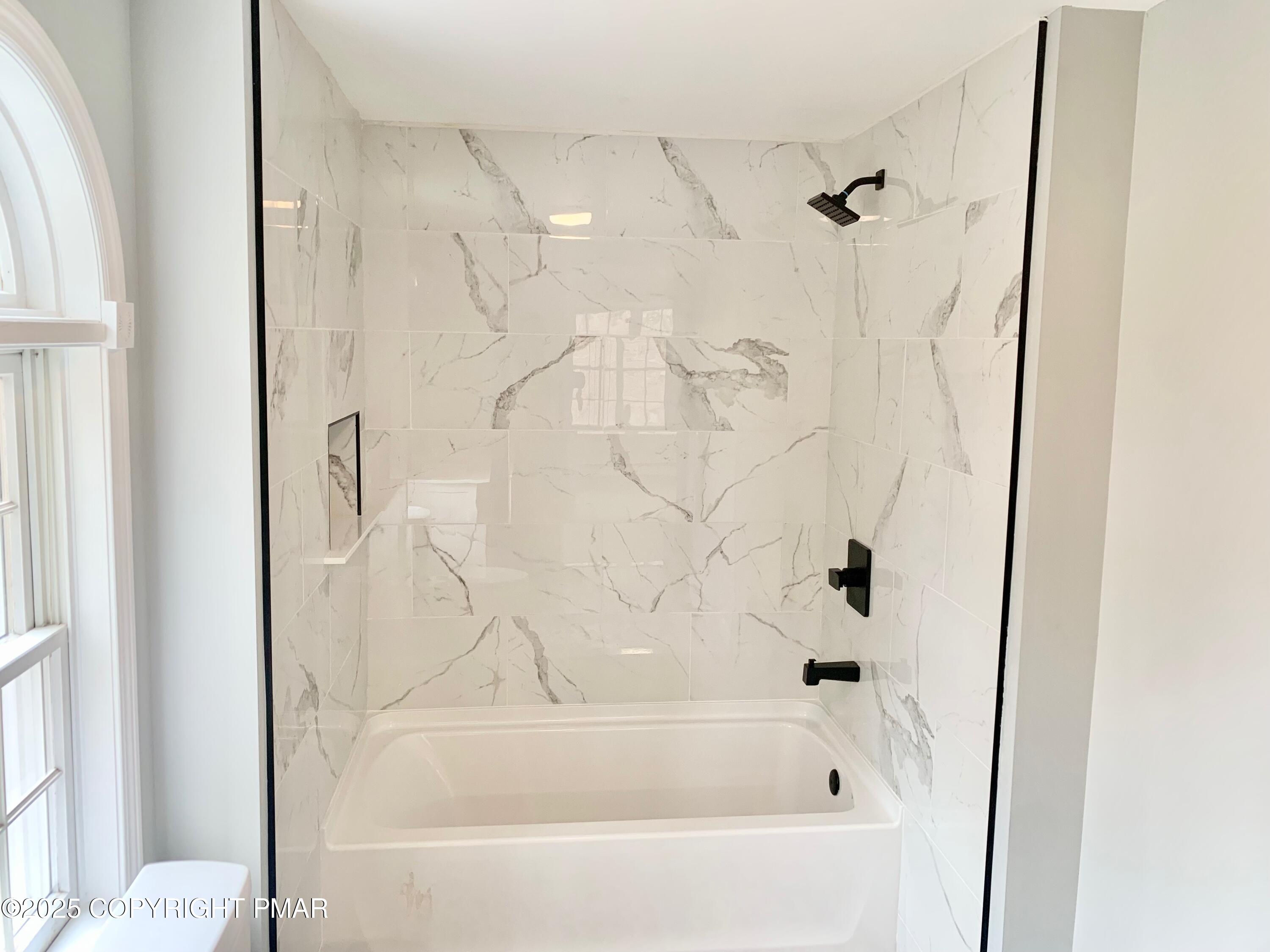 111 Lake In The Clouds Road Canadensis, PA 18325 - Photo 20 of 39 a bathroom with a bathtub