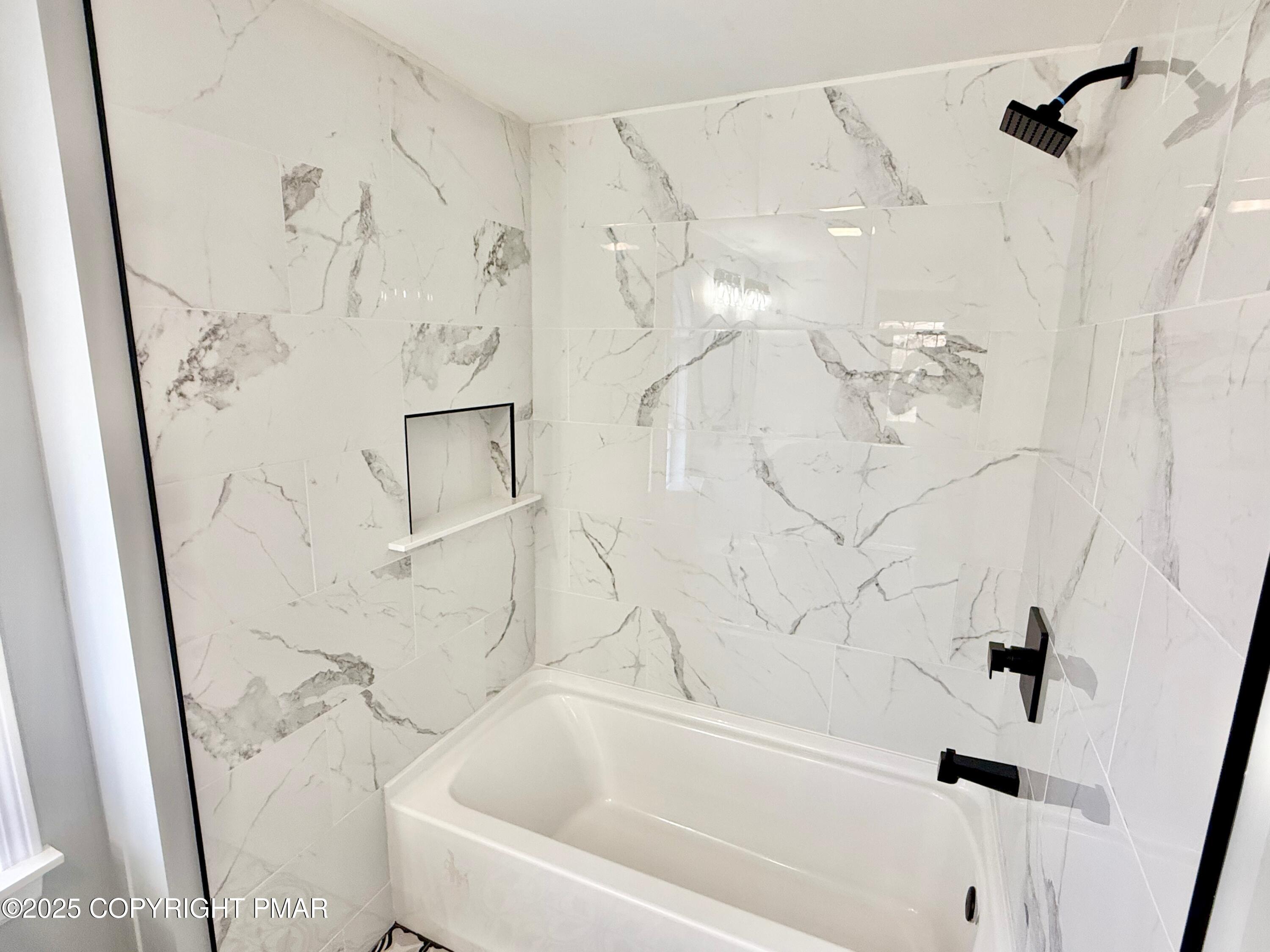 111 Lake In The Clouds Road Canadensis, PA 18325 - Photo 21 of 39 a bathroom with a bathtub