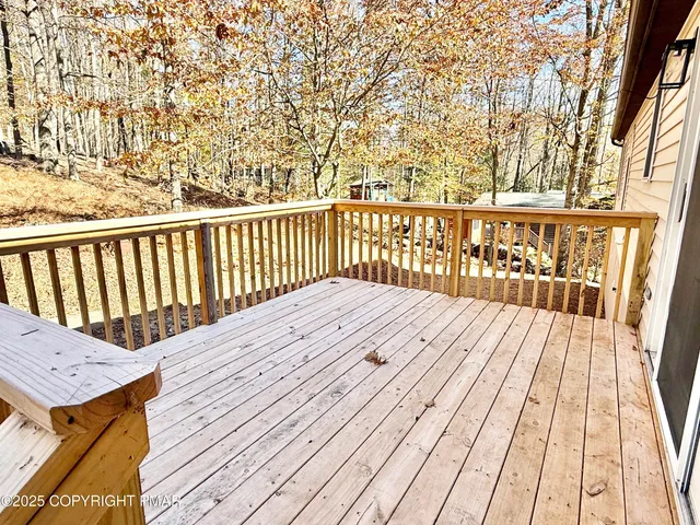 a view of balcony with wooden floor