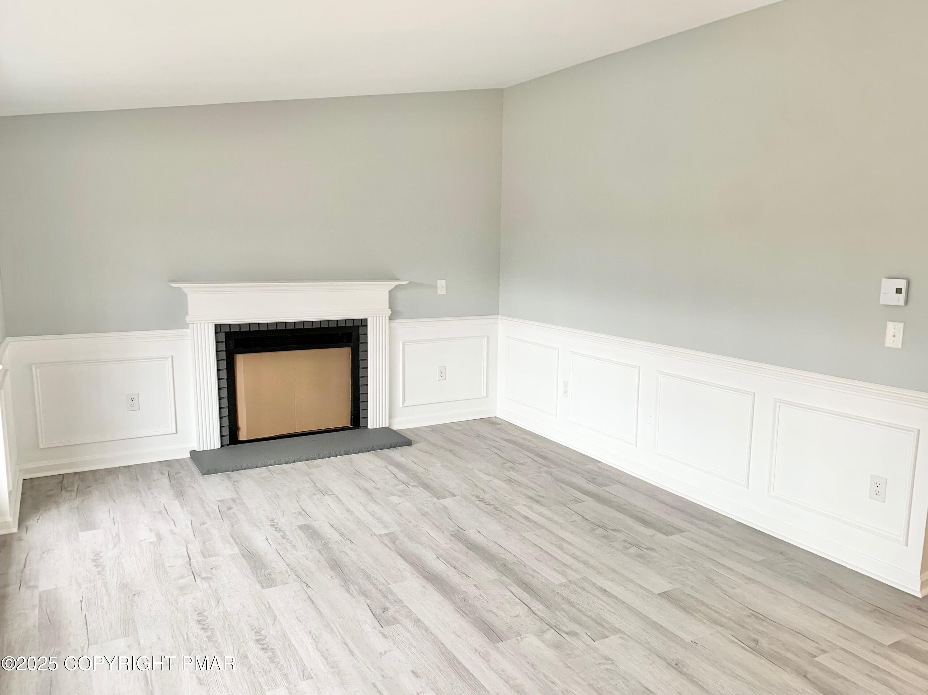111 Lake In The Clouds Road Canadensis, PA 18325 - Photo 6 of 39 a view of an empty room and wooden floor