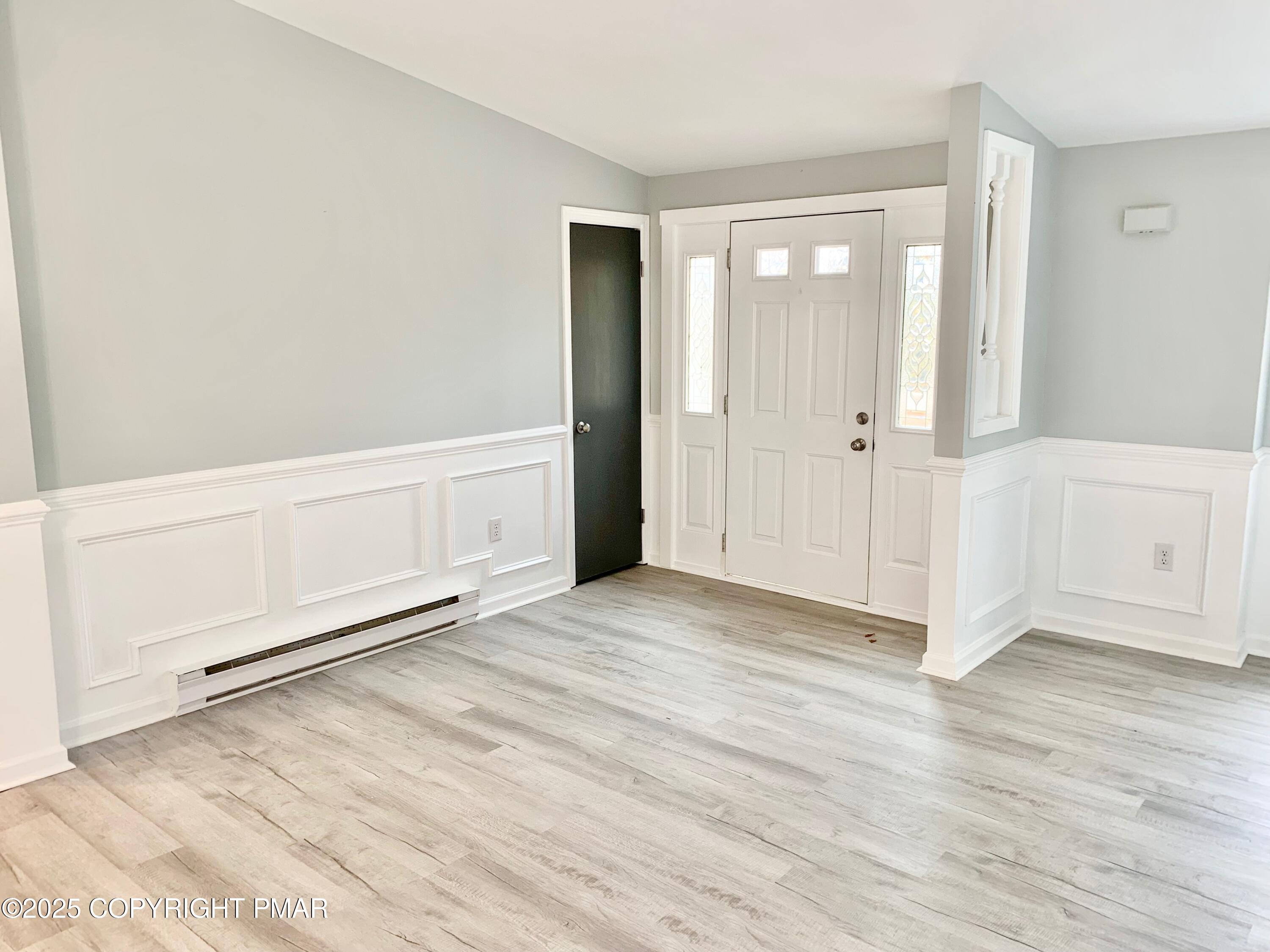 111 Lake In The Clouds Road Canadensis, PA 18325 - Photo 7 of 39 a view of an empty room with wooden floor