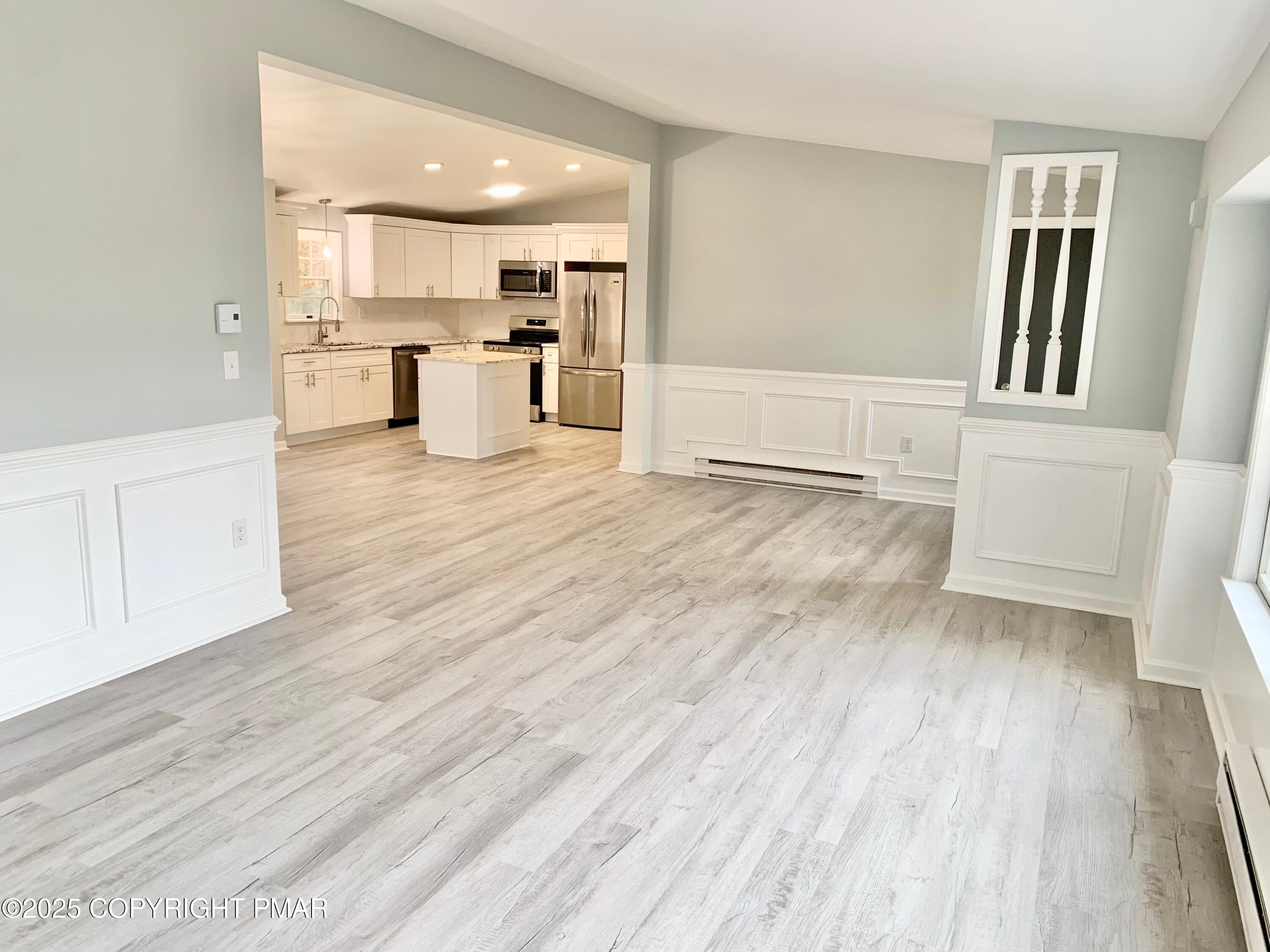 111 Lake In The Clouds Road Canadensis, PA 18325 - Photo 8 of 39 a view of a kitchen with wooden floor and a sink