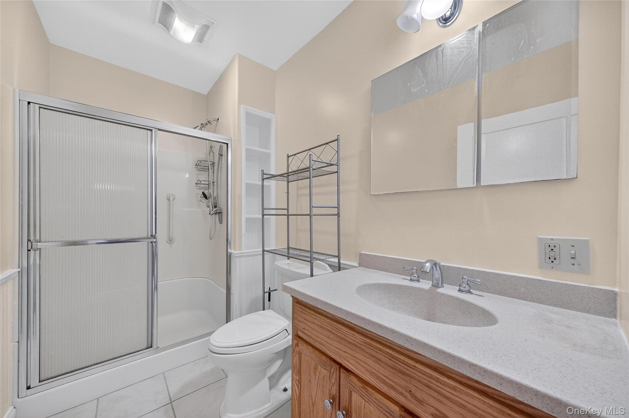 11 Zimmer Avenue, Unit 2 Poughkeepsie, NY 12601 - Photo 16 of 27 a bathroom with a sink toilet and shower