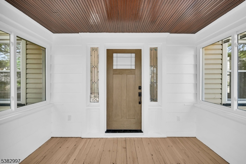 195 Sylvan Street Rutherford, NJ 07070 - Photo 14 of 50 an empty room with wooden floor and windows