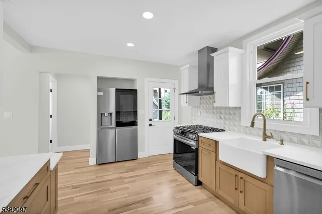 a kitchen with a sink stove and refrigerator