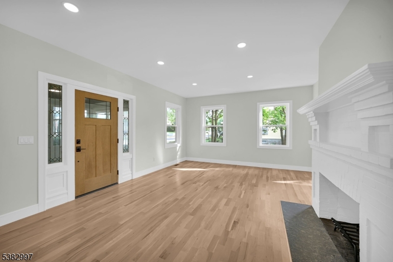 195 Sylvan Street Rutherford, NJ 07070 - Photo 22 of 50 a view of an empty room with wooden floor and a window