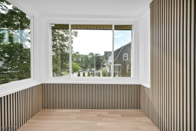 wooden floor in an empty room with a window and wooden floor