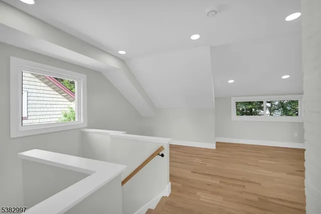 a view of an entryway with wooden floor