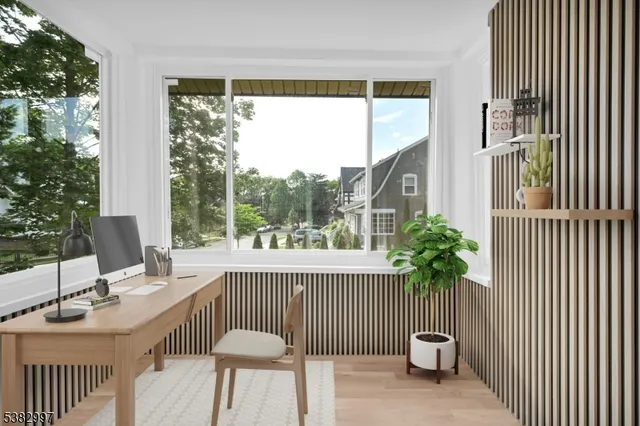 a spacious bedroom with a bed and a potted plant