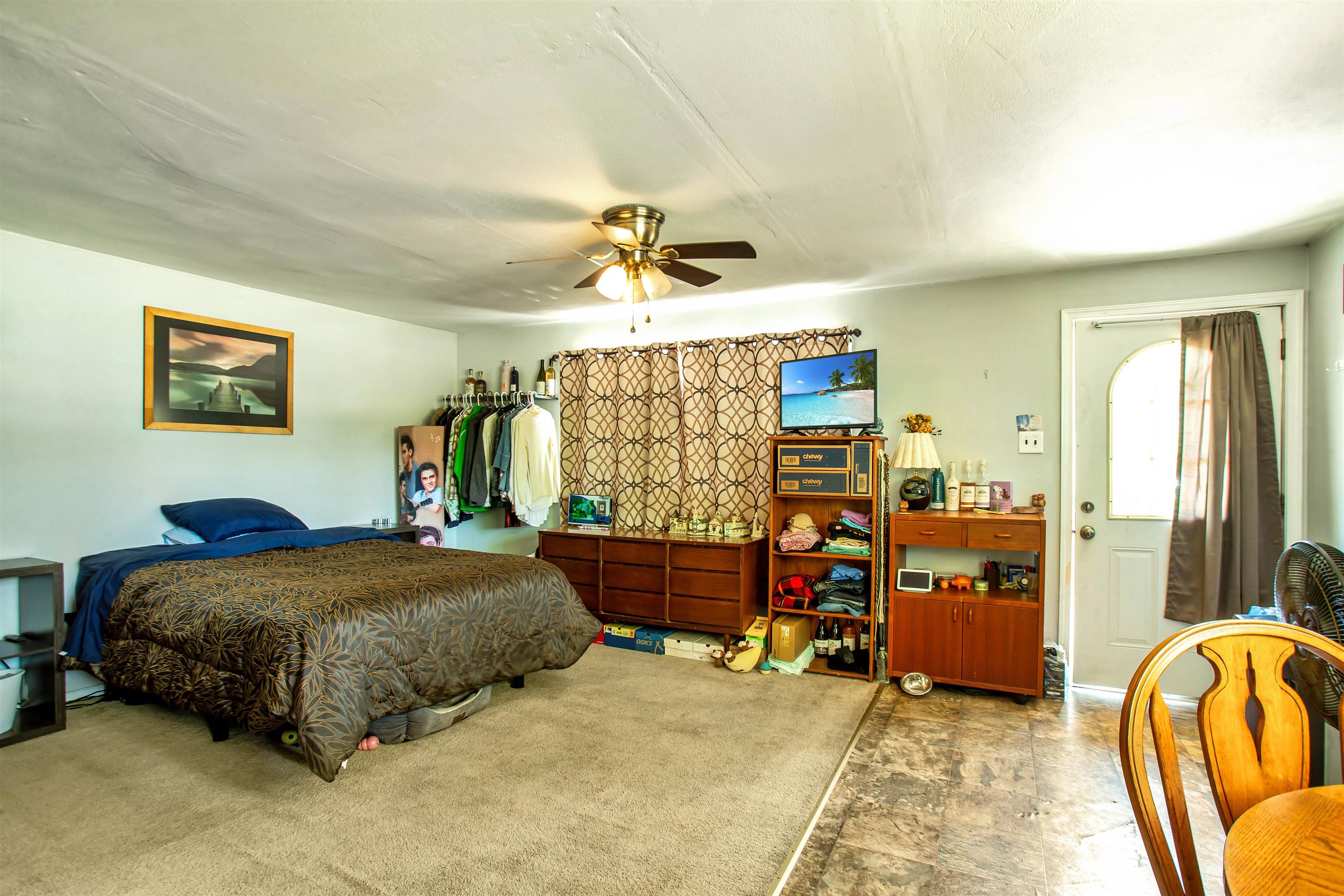 210 South Railroad Avenue Rio Grande, NJ 08242 - Photo 17 of 36 a bedroom with a bed and a chandelier