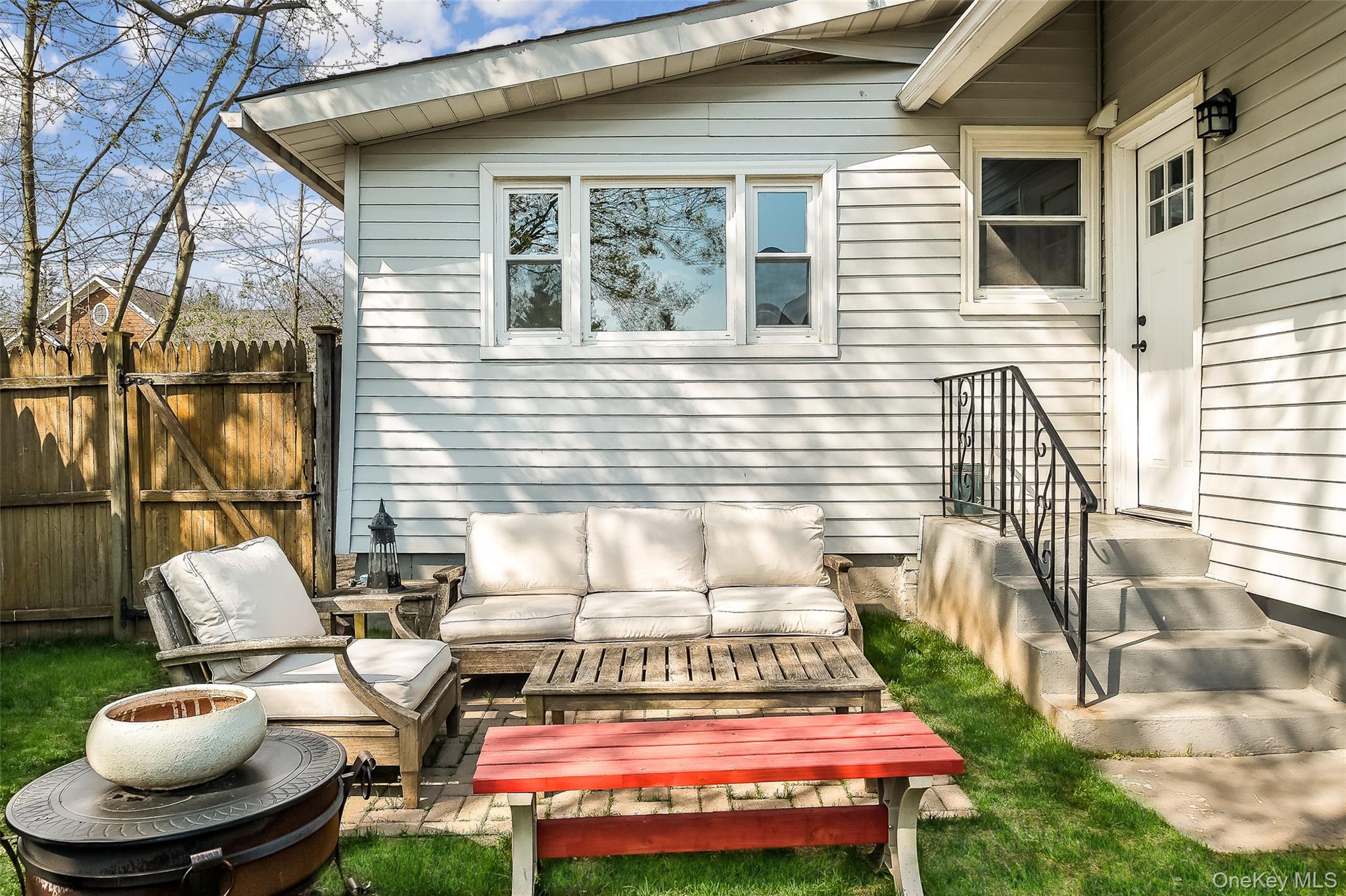 36 Dearborn Avenue Rye, NY 10580 - Photo 20 of 30 a backyard of a house with fire pit and furniture