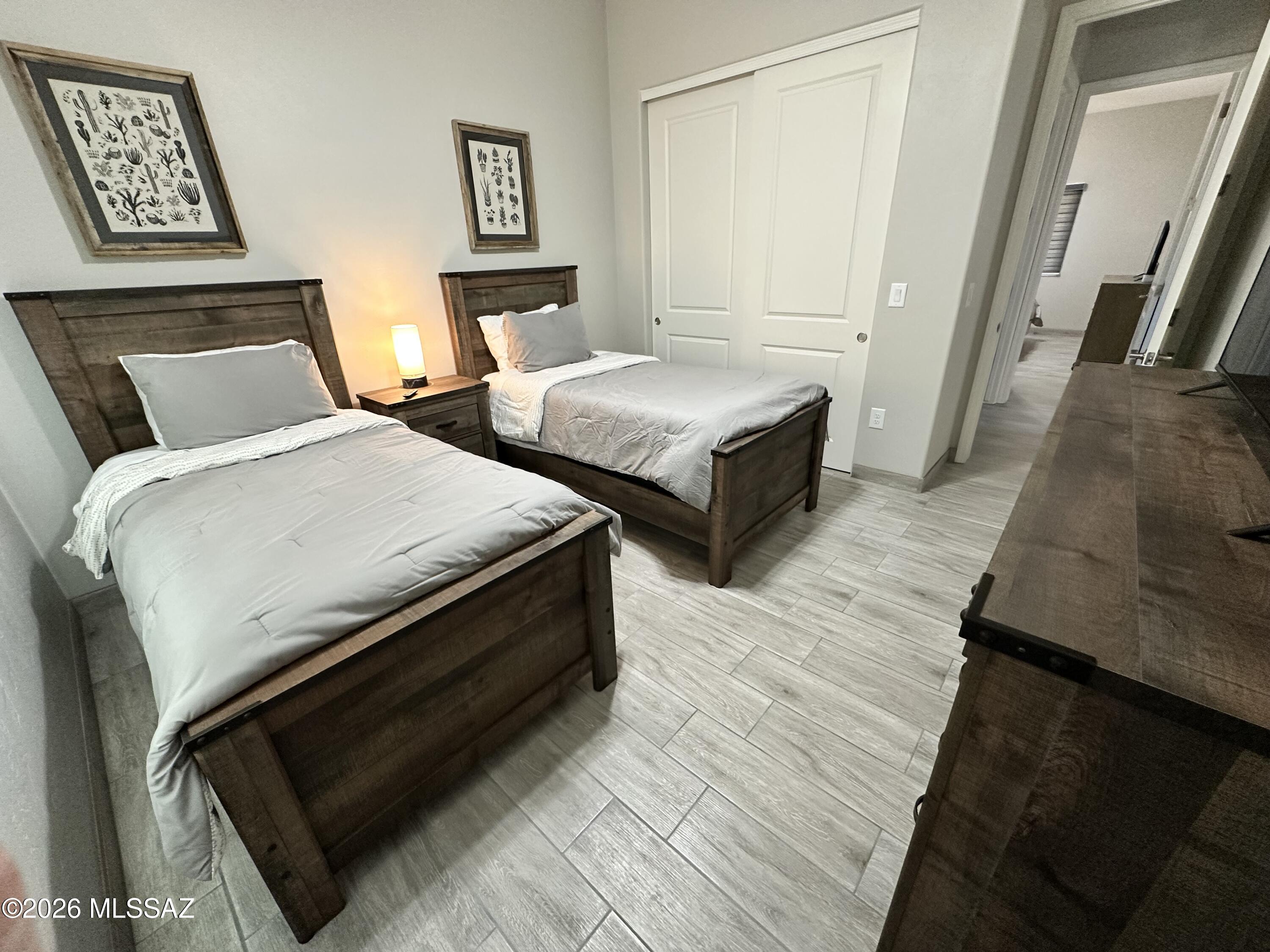 117 Ver Patria Rio Rico, AZ 85648 - Photo 13 of 28 a bedroom with two beds and a night stand